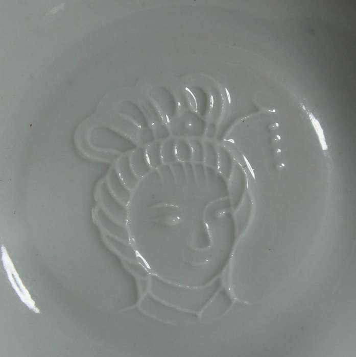 Very fine Emperors embossed face in cup