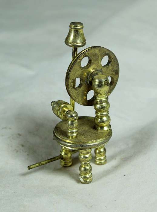 Miniature bronze spinning wheel