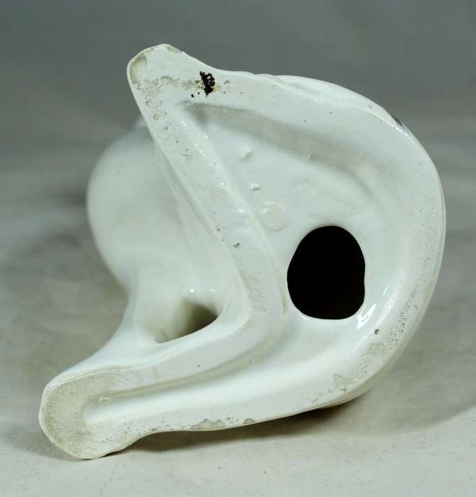 Seated slim white cat