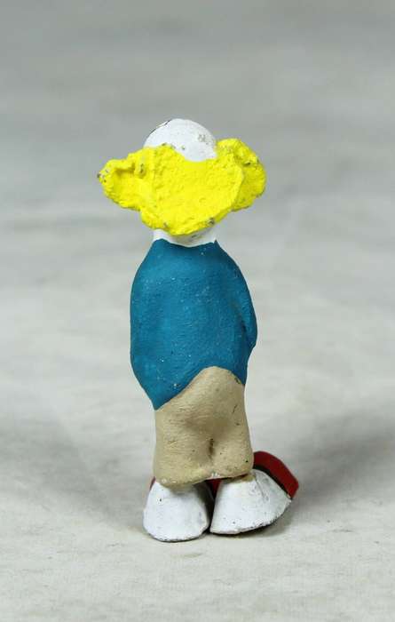 Miniature clown holding a present