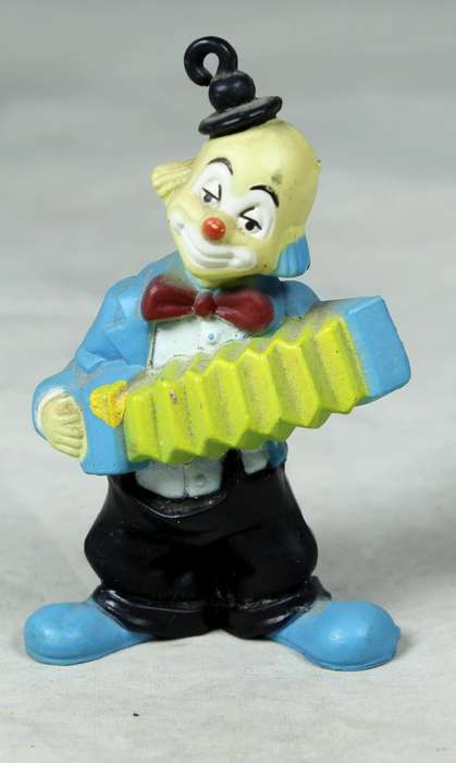Miniature clown with a concertina and top hat
