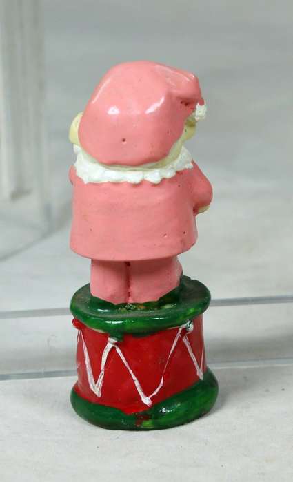 Miniature tramp standing on a drum