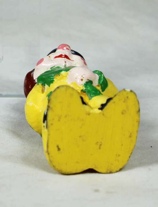 Miniature clown with a three leaf clover