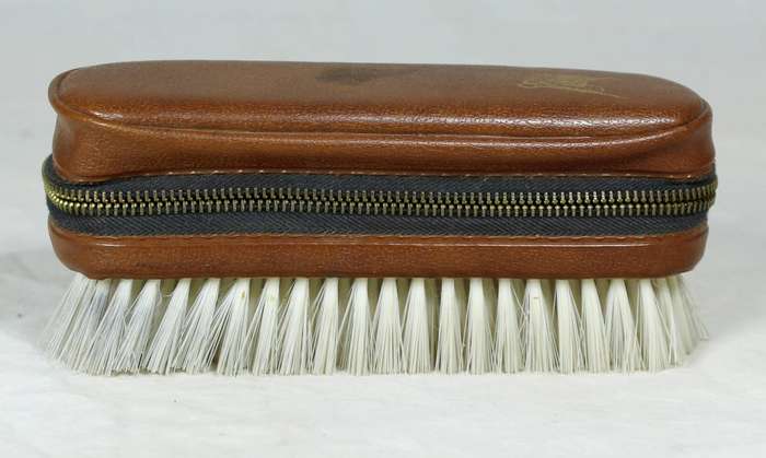 Brush with sewing kit