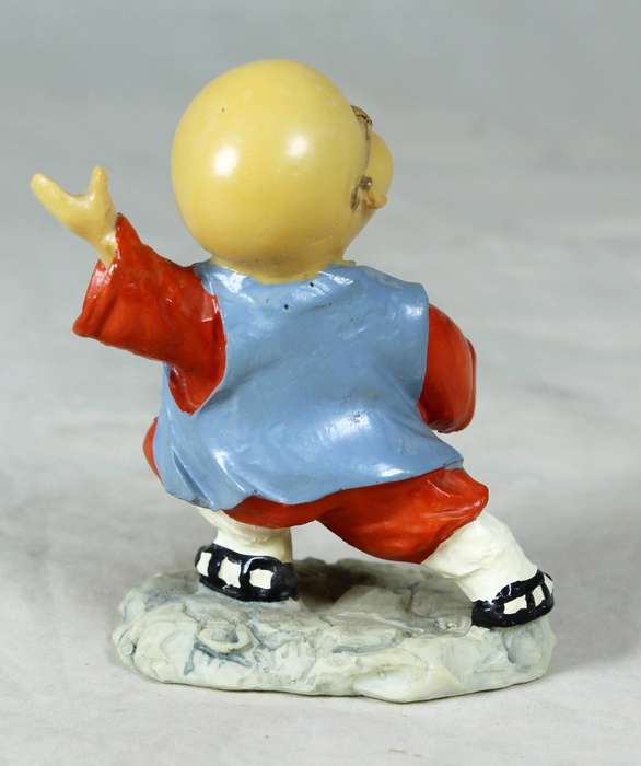 A baby Buddha - Monk striking a pose
