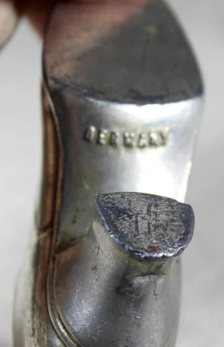 a pair of plated tin boots - made in Germany