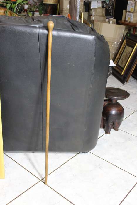 Wooden cane with a round top