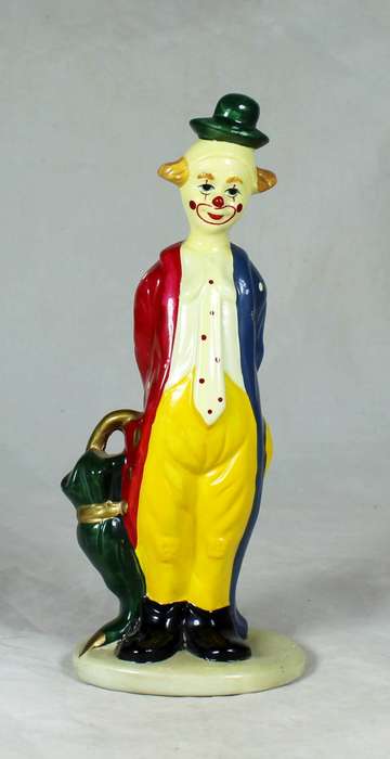 Clown figurine holding an umbrella