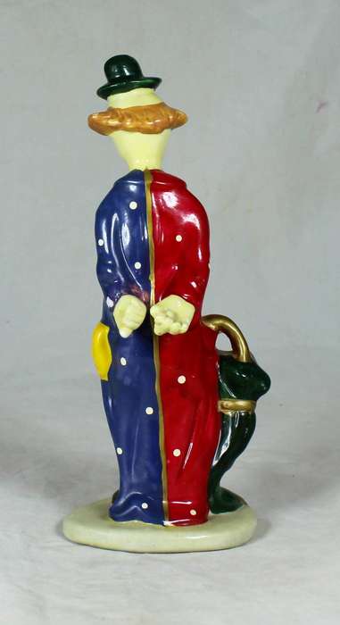 Clown figurine holding an umbrella