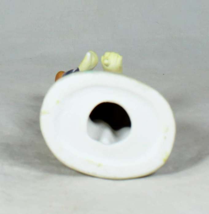 Clown figurine holding an umbrella