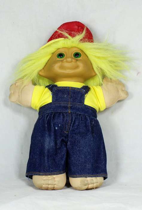 Large troll doll with denim dungarees