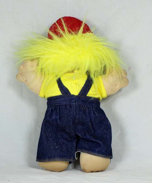 Large troll doll with denim dungarees