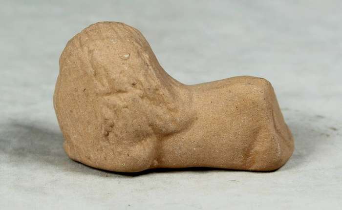 Miniature unglazed lion