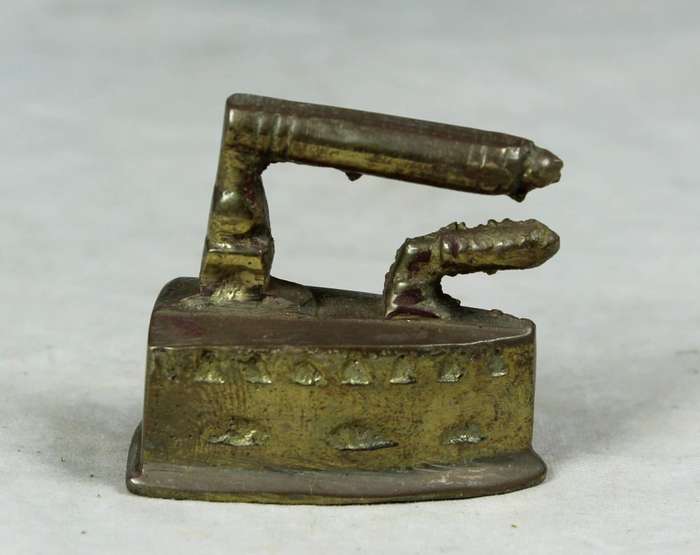 Miniature brass coal iron