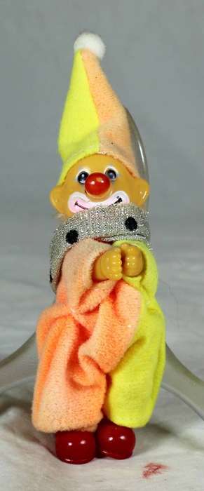 Plastic clown with red shoes