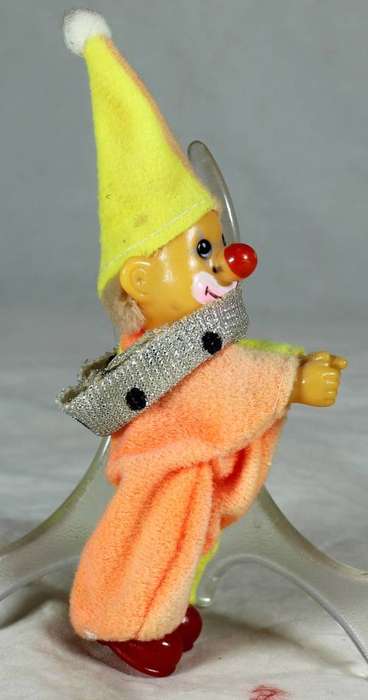 Plastic clown with red shoes