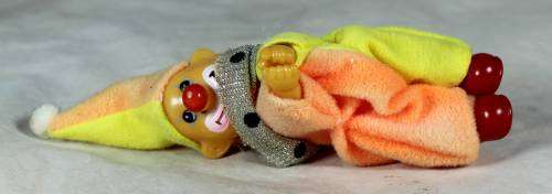 Plastic clown with red shoes
