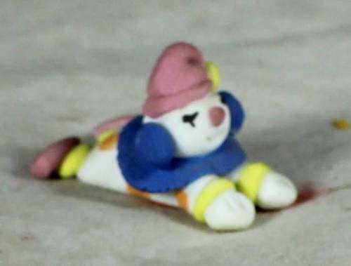Miniature clown laying down