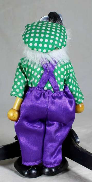 Wooden clown in a red bowtie
