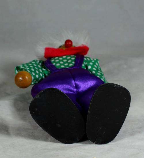 Wooden clown in a red bowtie