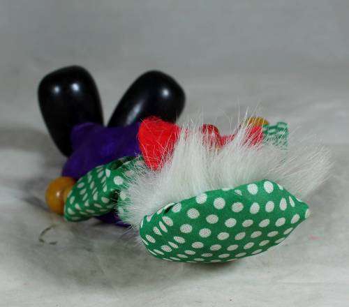 Wooden clown in a red bowtie