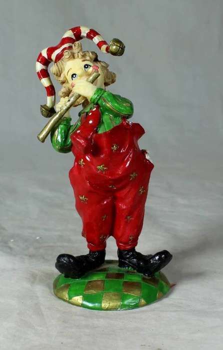 Molded clown playing the flute
