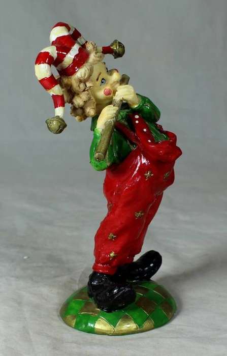 Molded clown playing the flute