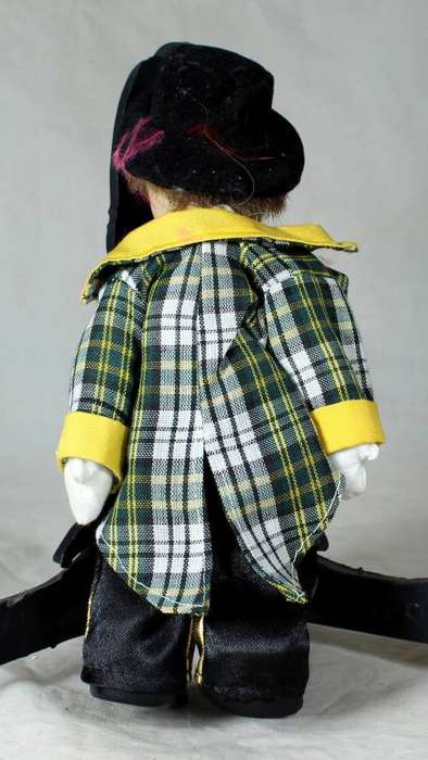 Porcelain and cloth clown in a polka dot tie