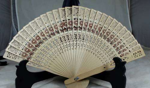 Perforated wooden fan