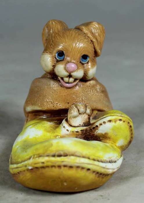 Yellow stone craft rabbit in a glove