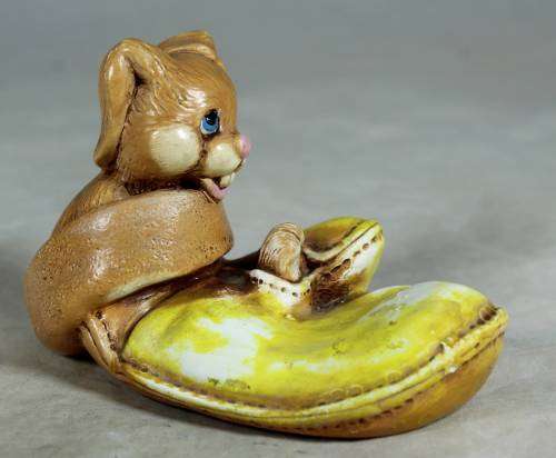 Yellow stone craft rabbit in a glove
