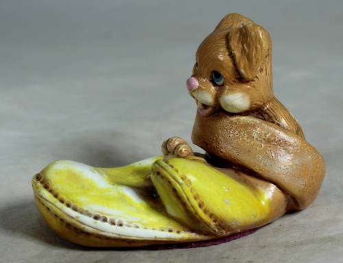 Yellow stone craft rabbit in a glove
