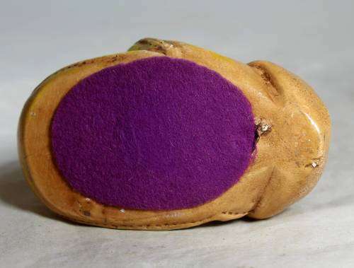 Yellow stone craft rabbit in a glove