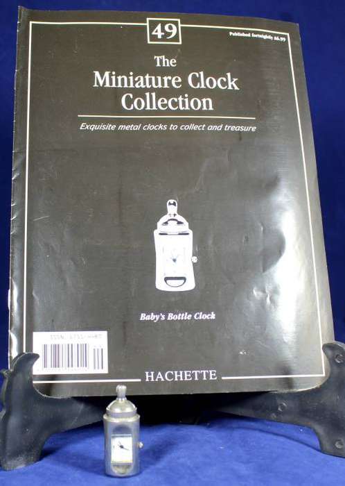 Hachette clock with booklet - Babies bottle
