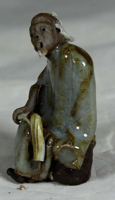Collectible mud men - man holding a whip