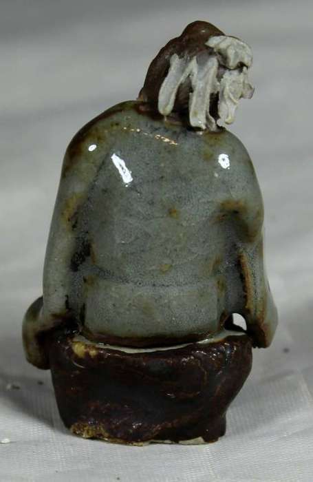 Collectible mud men - man holding a whip