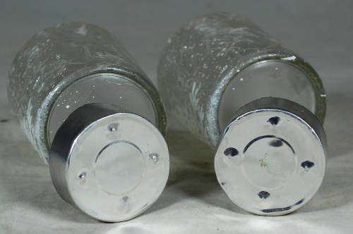 Pair of decorated glasses with candles