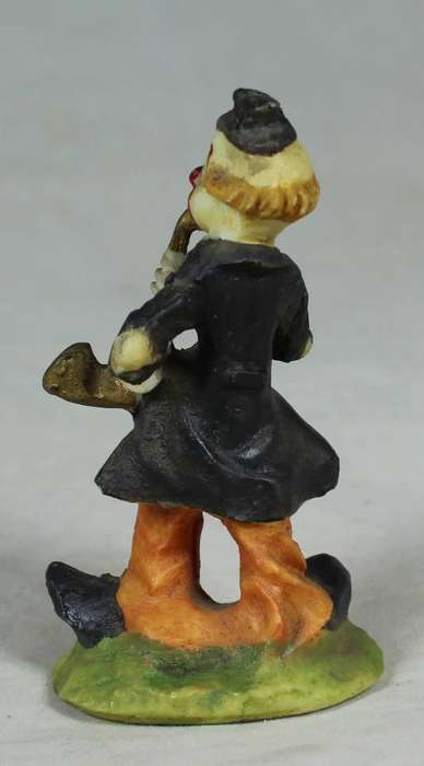 Miniature clown playing a saxophone