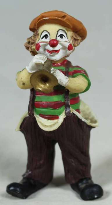 Miniature clown playing a trumpet