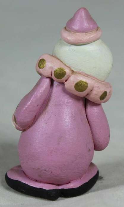 Miniature clown in pink, smiling
