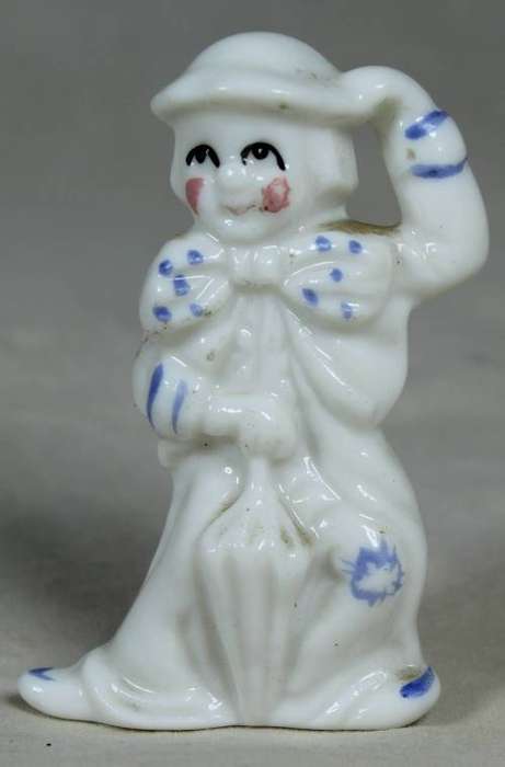 Miniature clown lady with an umbrella