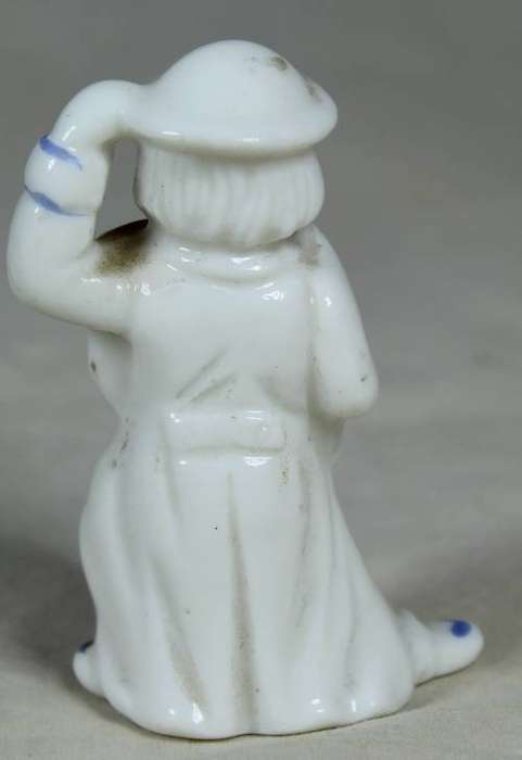 Miniature clown lady with an umbrella