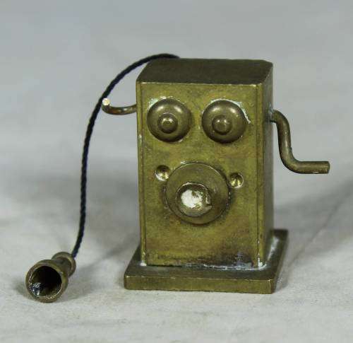 Miniature bronze vintage telephone