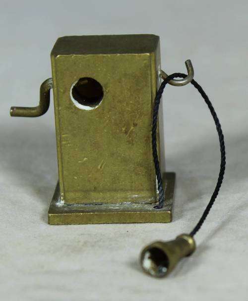 Miniature bronze vintage telephone