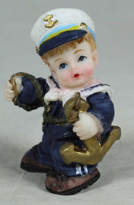 Kid sailor in blue holding an anchor