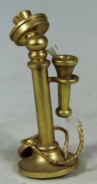 Miniature brass telephone