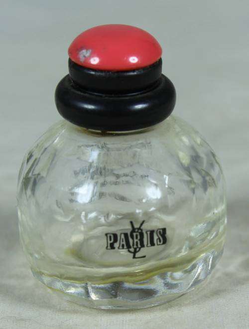 Empty Yves Saint Laurent Eau de Toilett perfume bottle