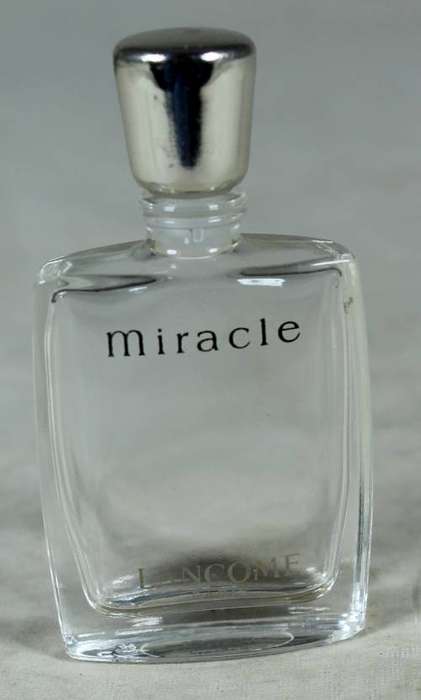 Empty miniature Lancome Miracle perfume bottle