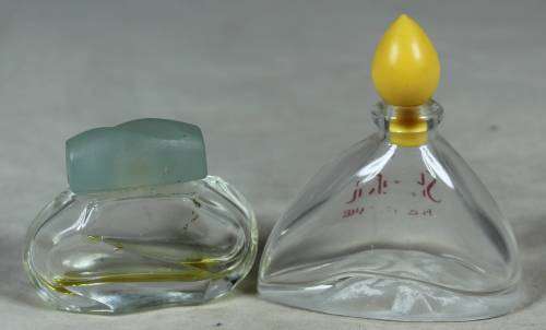 Empty pair of perfume bottles