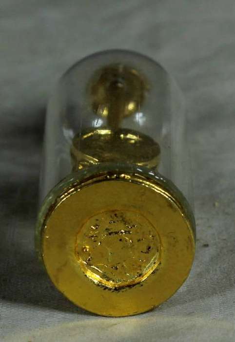 Miniature brass clock in dome